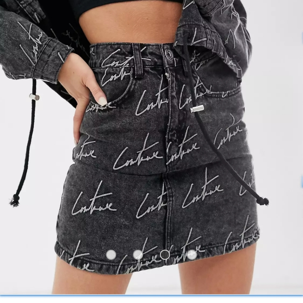 The couture Club Embroidery washed out black Jean Skirt. Size S.